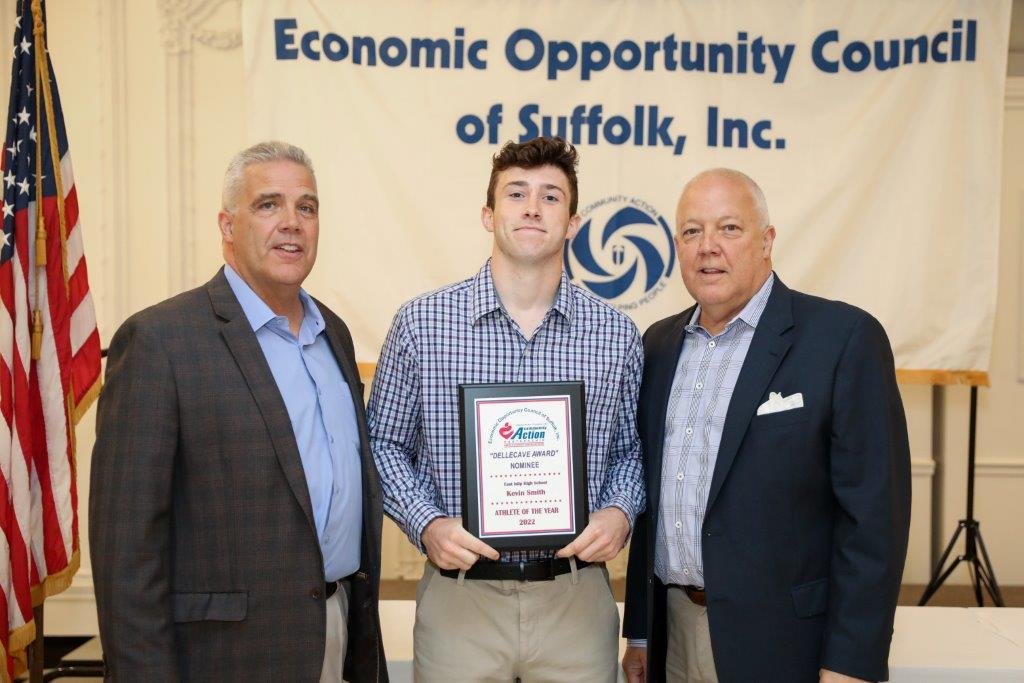 East Islip High School nominee Kevin Smith is flanked by Dellecave Foundation co-directors (left) Mark Dellecave and (right) Guy Dellecave.